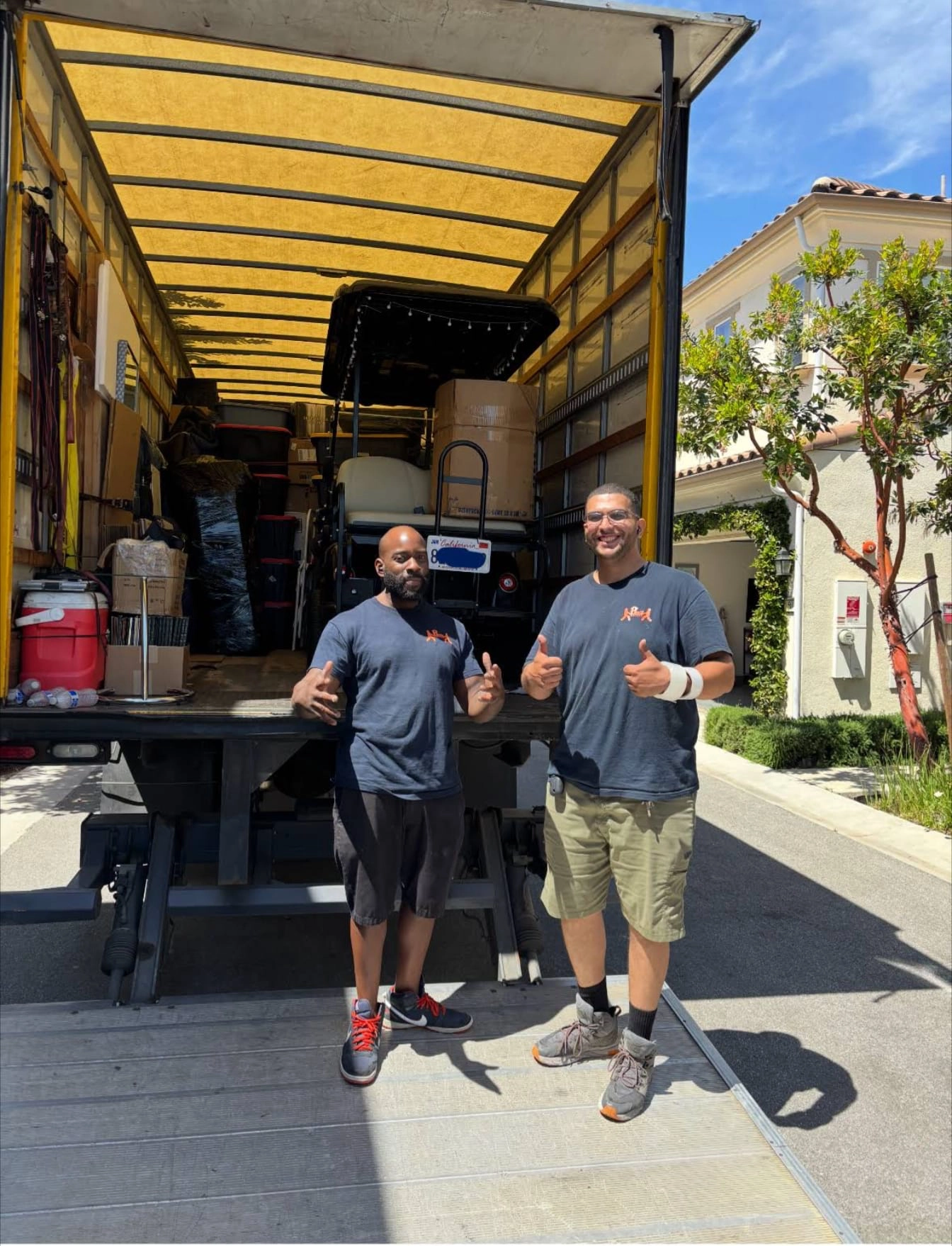 Helpful Moving team loading furniture into truck